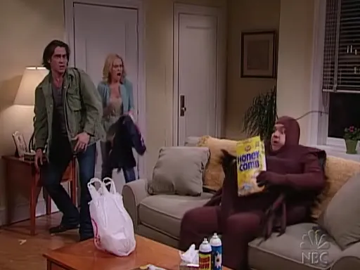 Colin Farrell (green jacket), Amy Poelher (blue cardigan), look at Horatio Sanz in a cockroach costume eating cereal