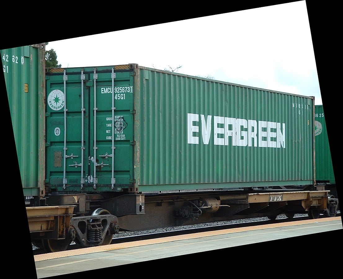 Green train car with word "evergreen" on it