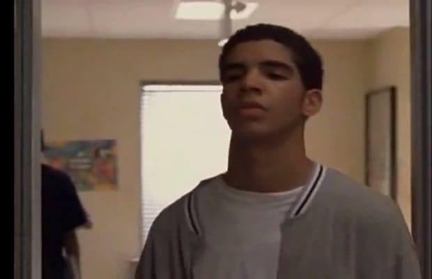 Close-up of Drake on Degrassi, in a gray letterman jacket