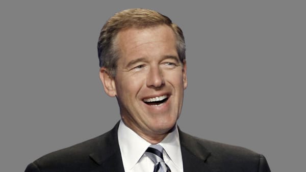 Brian Williams in a suit and tie, apparently mid-laugh,, against a gray background.
