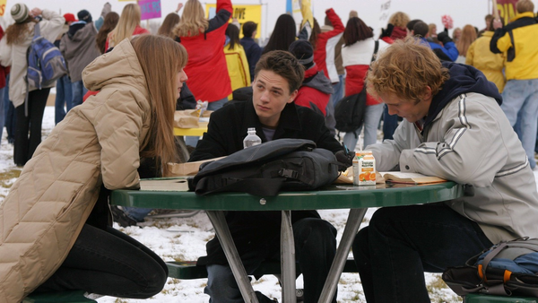 Amy, Ephram, and Bright eat outside in the winter.