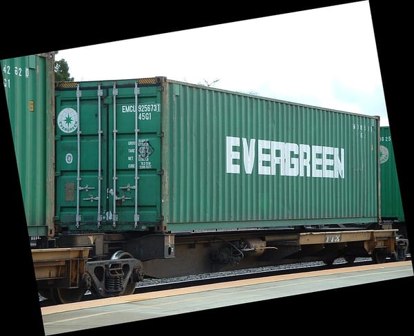 Green train car with word "evergreen" on it